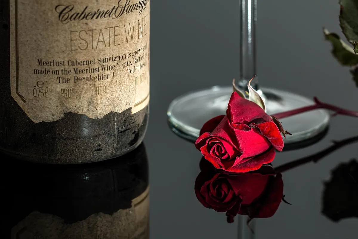 rose, wine, rose flower, red, romantic, bottle, drink, glass, vintage, red rose, wine glass, alcohol, beverage, cabernet sauvignon, wine bottle, reflection